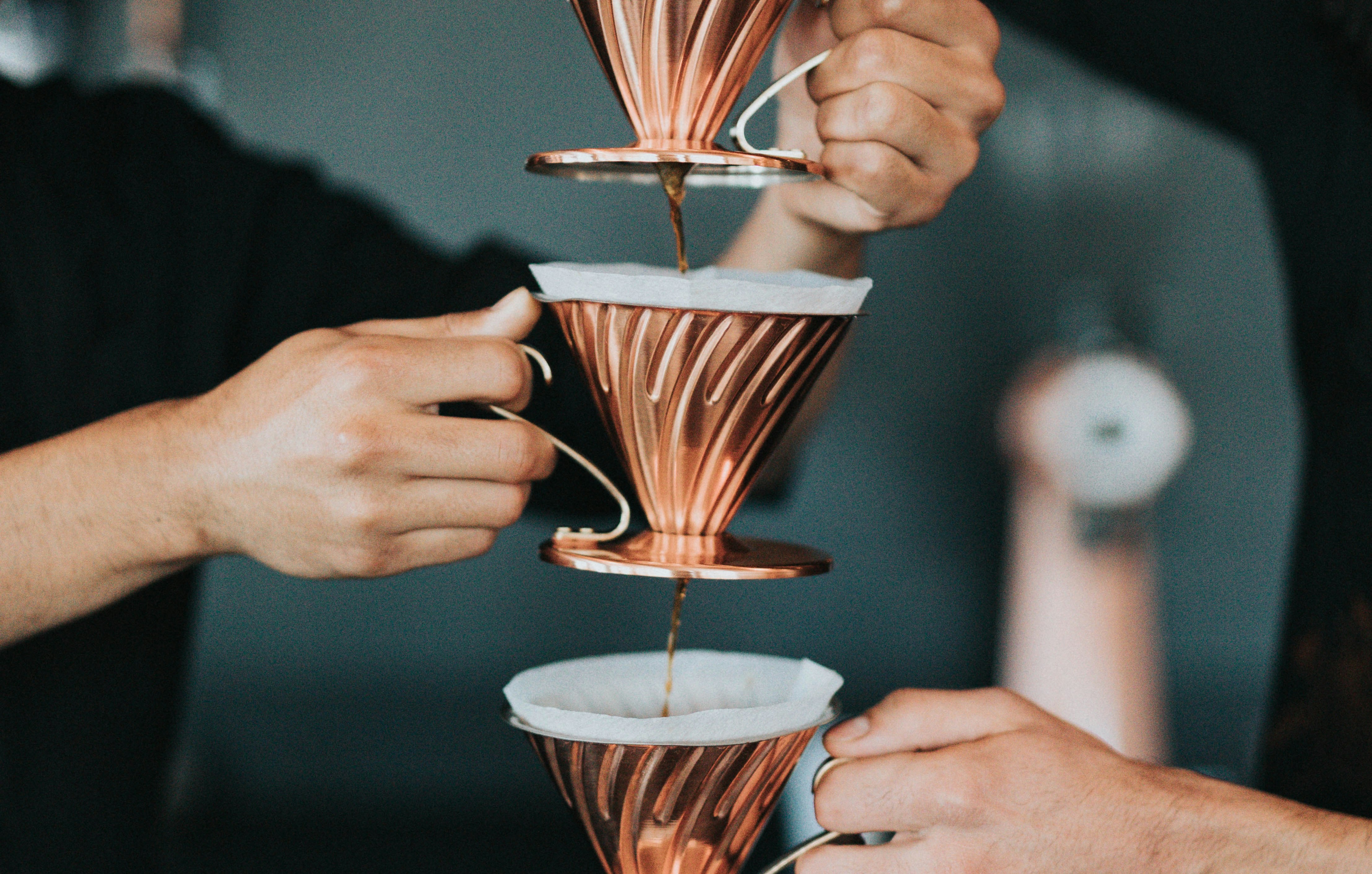 Coffee being poured through multiple filters