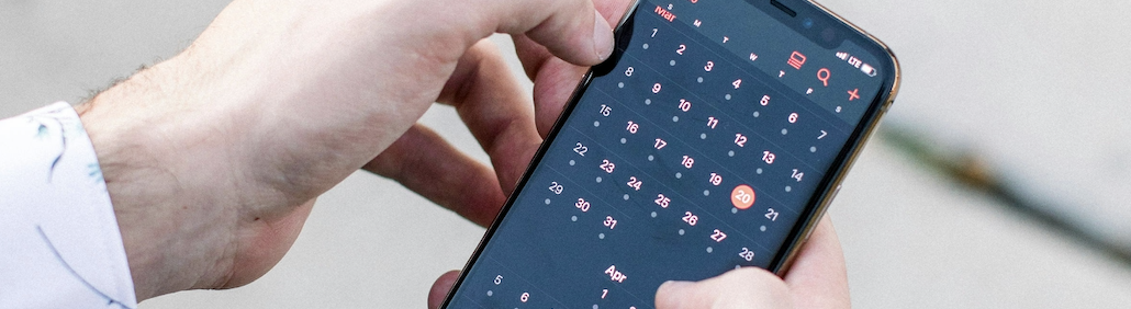 Man checking his phone calendar