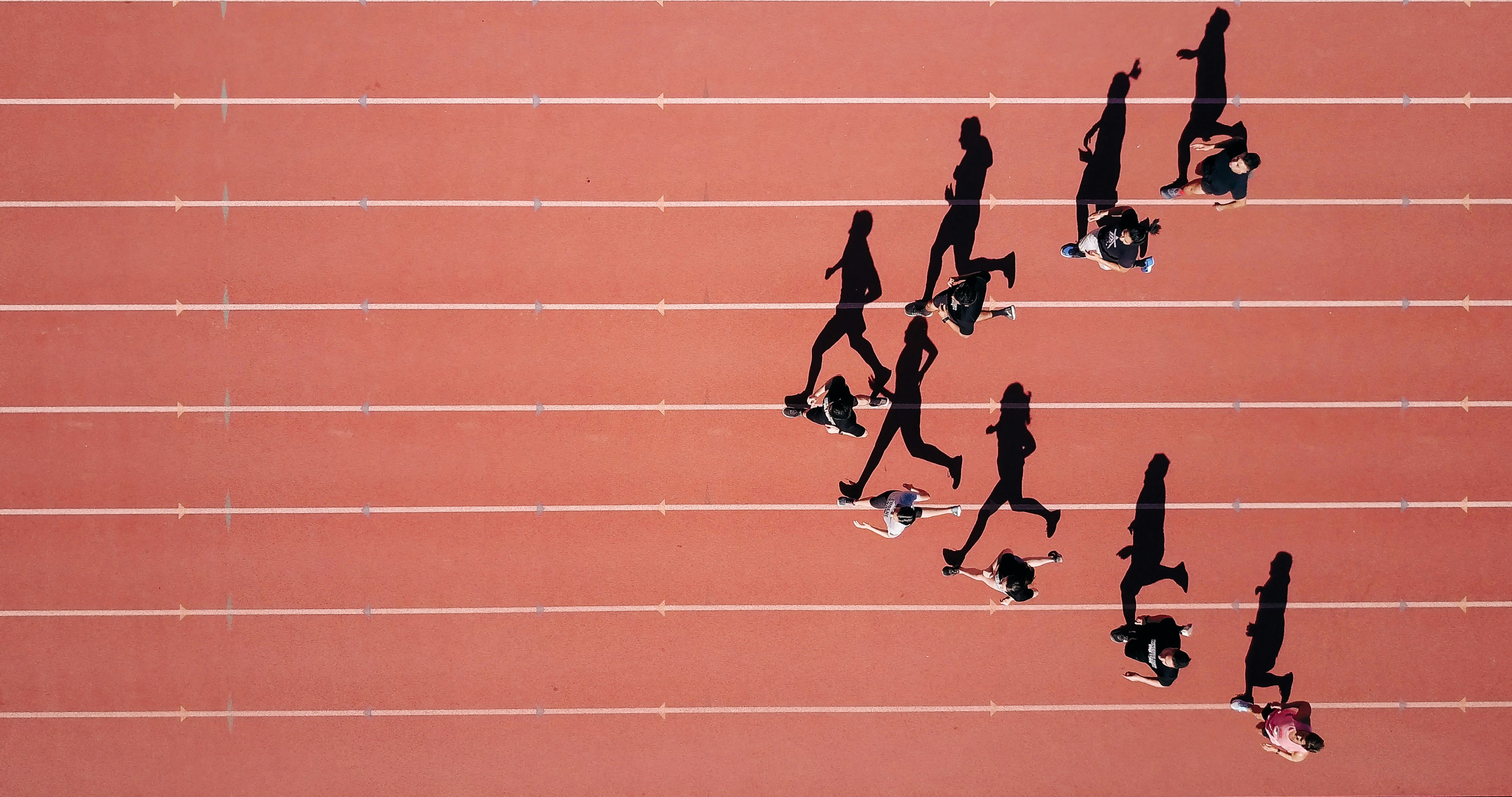 Team of runners running together during a race.